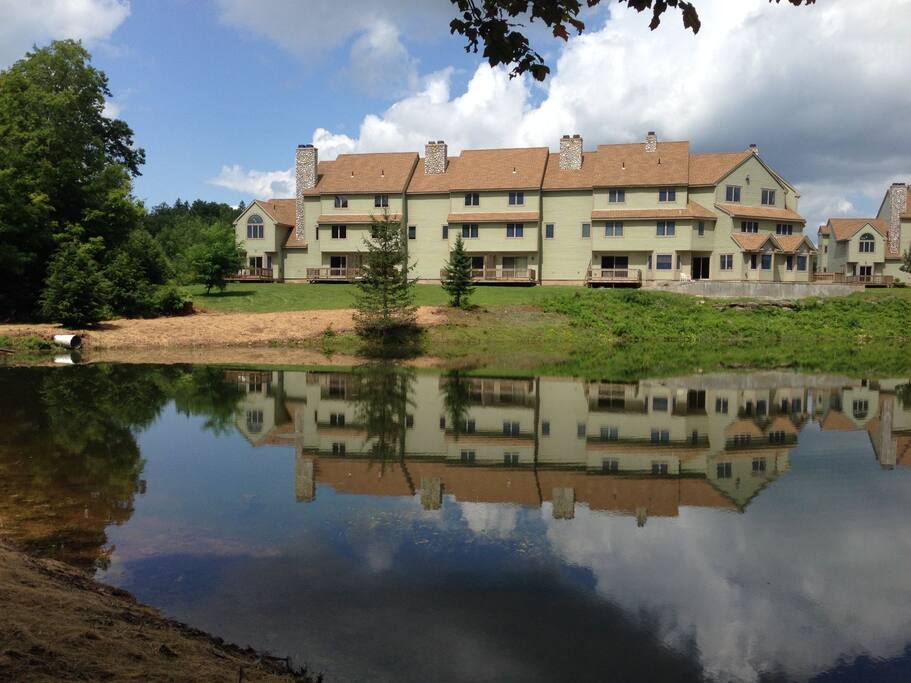 View from the opposite side of the pond. The condo is the last one on the left.