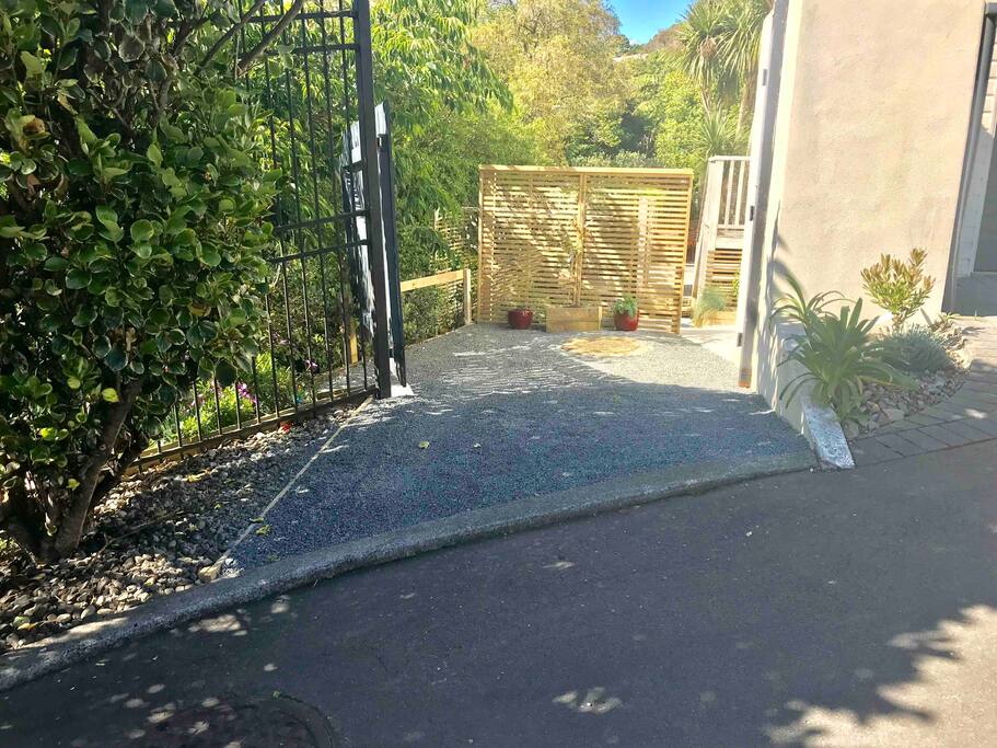Entrance way and a place to park your car.