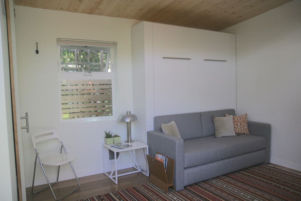 Bright and airy interior with clerestory windows and shades for privacy