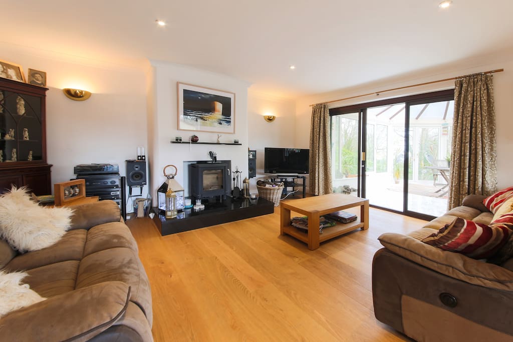 Beautiful lounge featuring Cornish art and a log burner for cooler evenings.