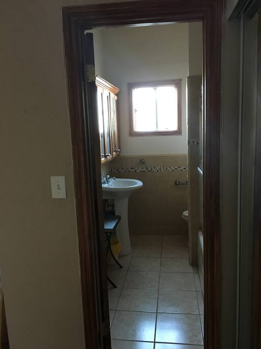 full bathroom! fully stocked cabinets with your basic needs. 100% empty shelfs for your personal belonging behind door and spot for your towel. blow dryer and straightener for your use.