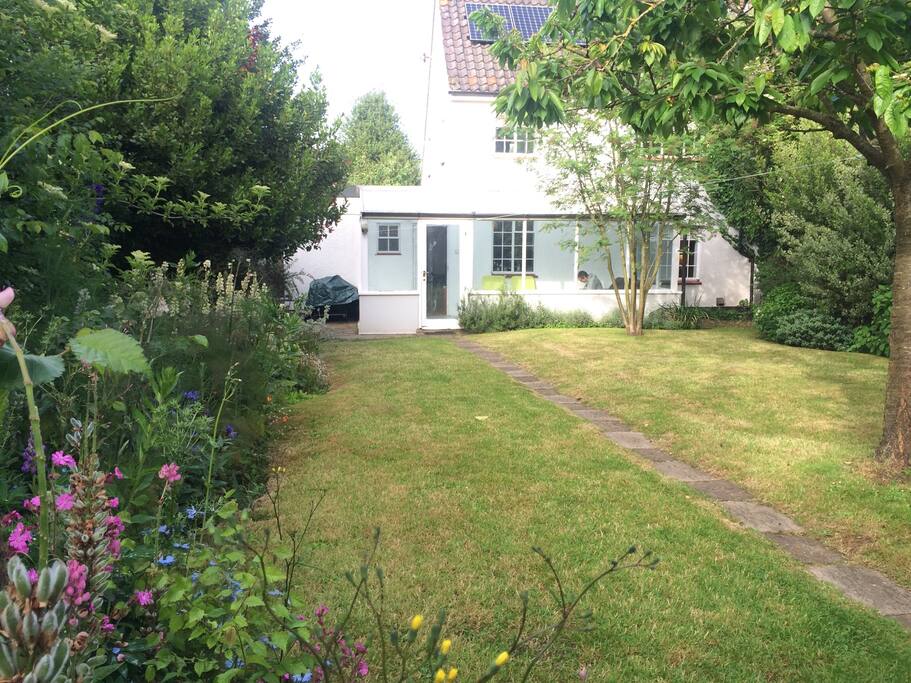 Lovely back garden with BBQ, outdoor table, trampoline and sunloungers