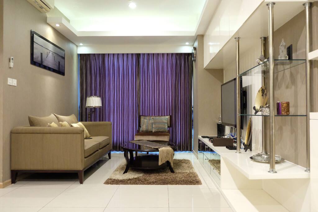 Spacious living room with 60" TV