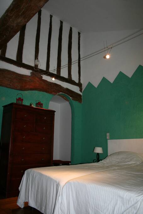 Chambre Verte with hardwood floor, oak beam ceiling with en suite bathroom