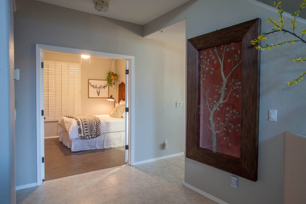 From the front door, enter your room through the double doors on the left.