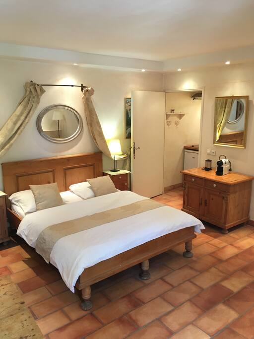 The lovely bedroom, kitchen in the background