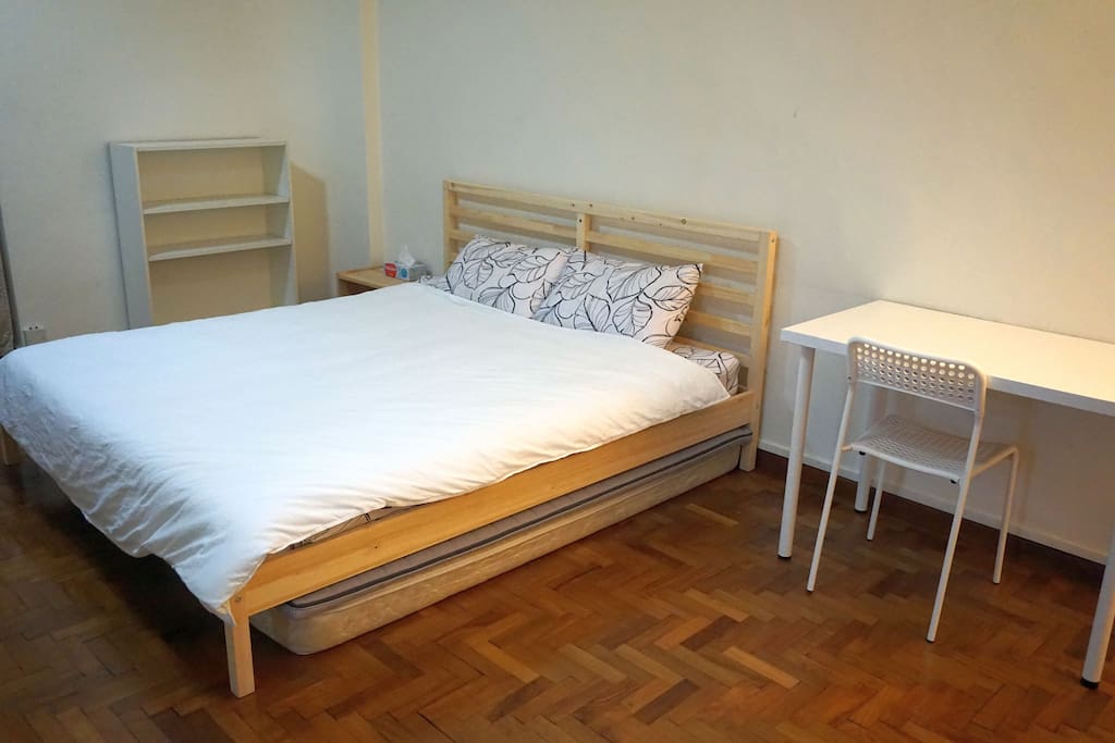 Additional single beds are under the large king bed.