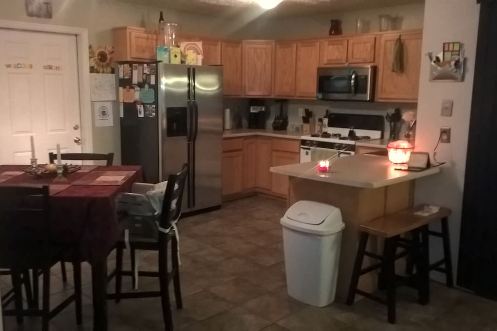 Kitchen and Dining area equipped with microwave, toaster, blender and coffee maker