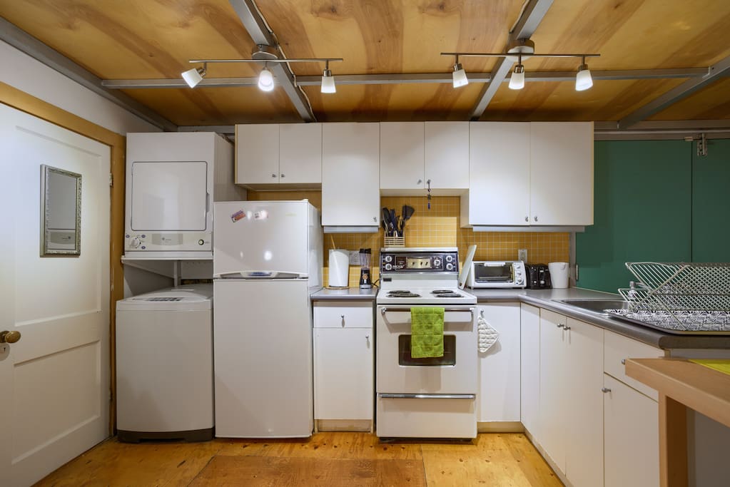 Kitchen with washer and dryer