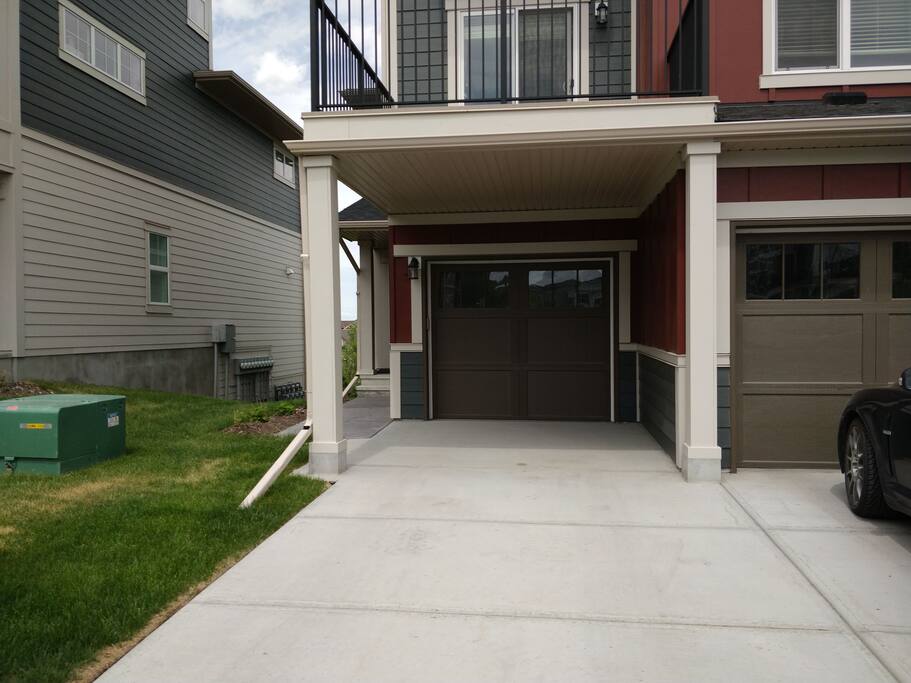 Driveway of the townhouse. Driveway holds one, garage holds one
