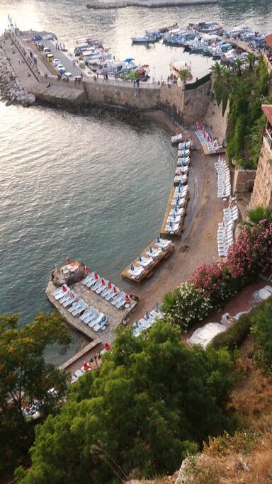 Private beach next to harbour