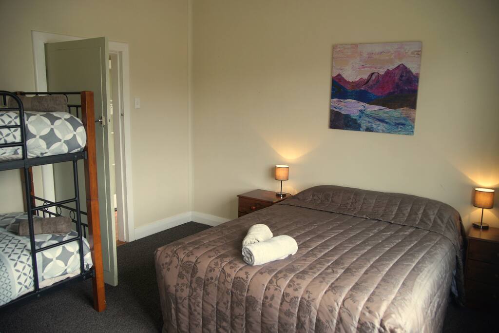 Main bedroom with Queen bed and set of single bunks.