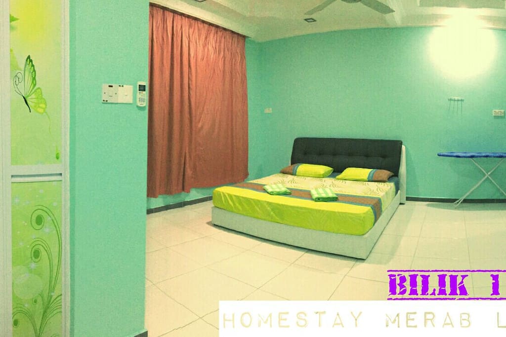 Master Bedroom with King Bed c/w airconditioning, ceiling fan, iron, iron board, wardrobe and personal toilet.