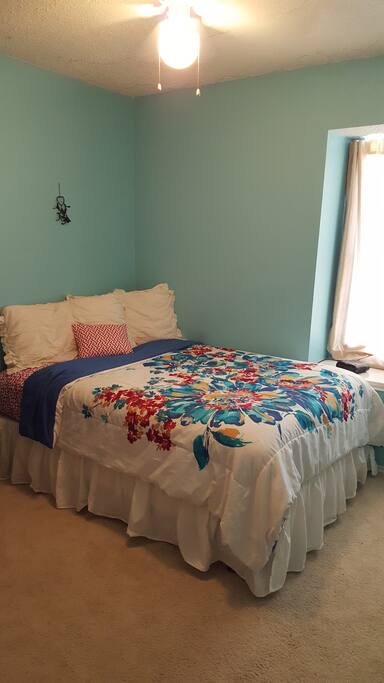 Clean, simple bedroom with lots of natural light.
