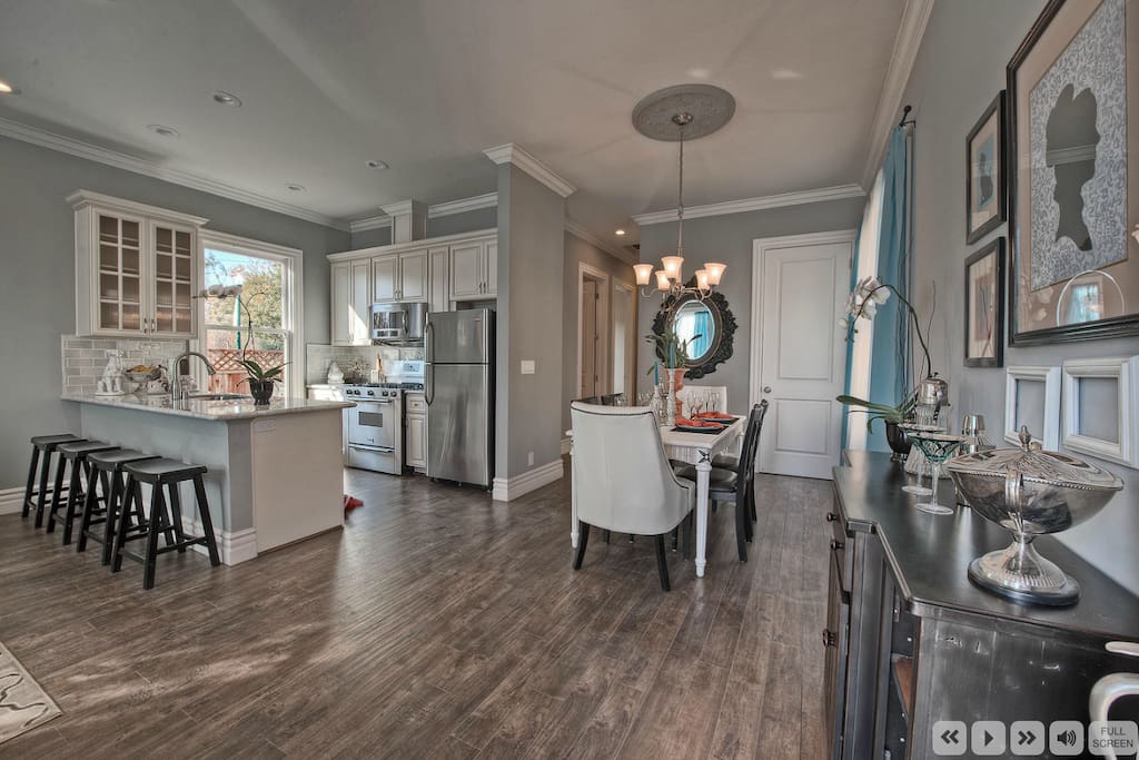 Great Room View 1: 10 foot ceilings with marble and stainless steel kitchen.