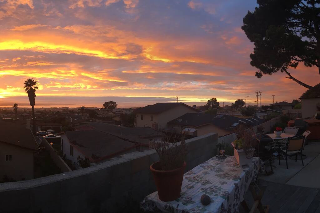 Large backyard patio and deck with panoramic views of the bay