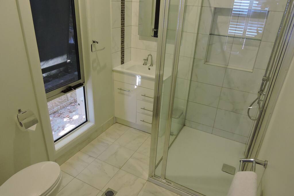 The En-suite has a roomy shower and vanity as well as a toilet.
