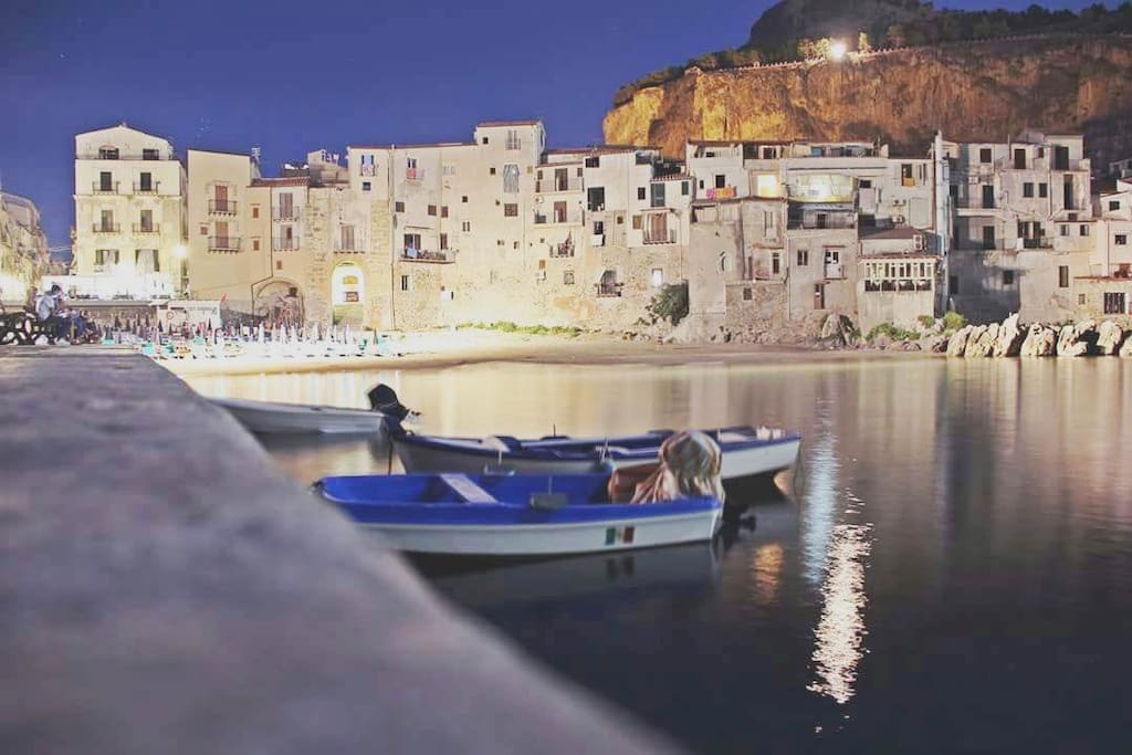 the small port of Cefalù with typical Sicilian fishermen's boats