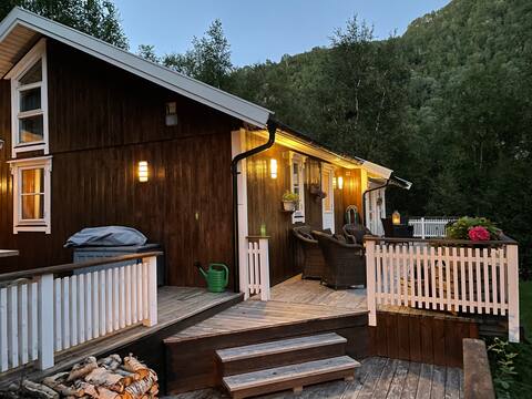 Find peace and quiet in cozy cabin close to mountains and sea.