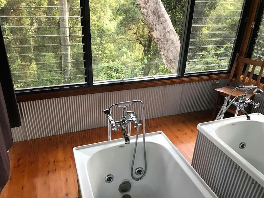 Side by side bathhouse with a leafy outlook