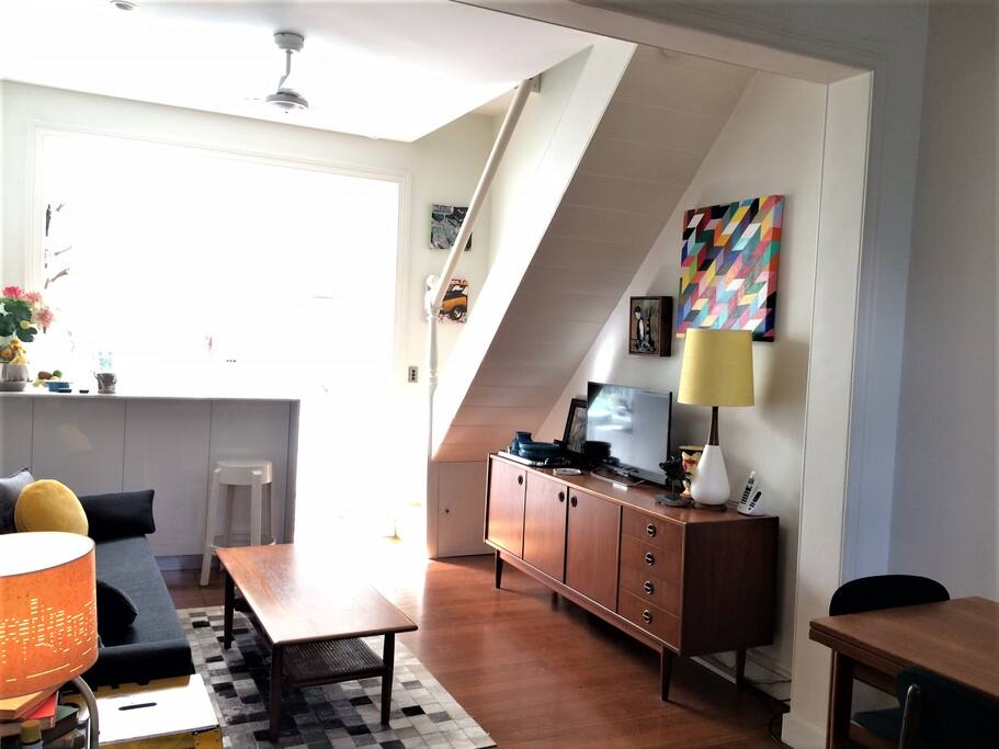 Bright sitting room, looking towards the sunny kitchen
