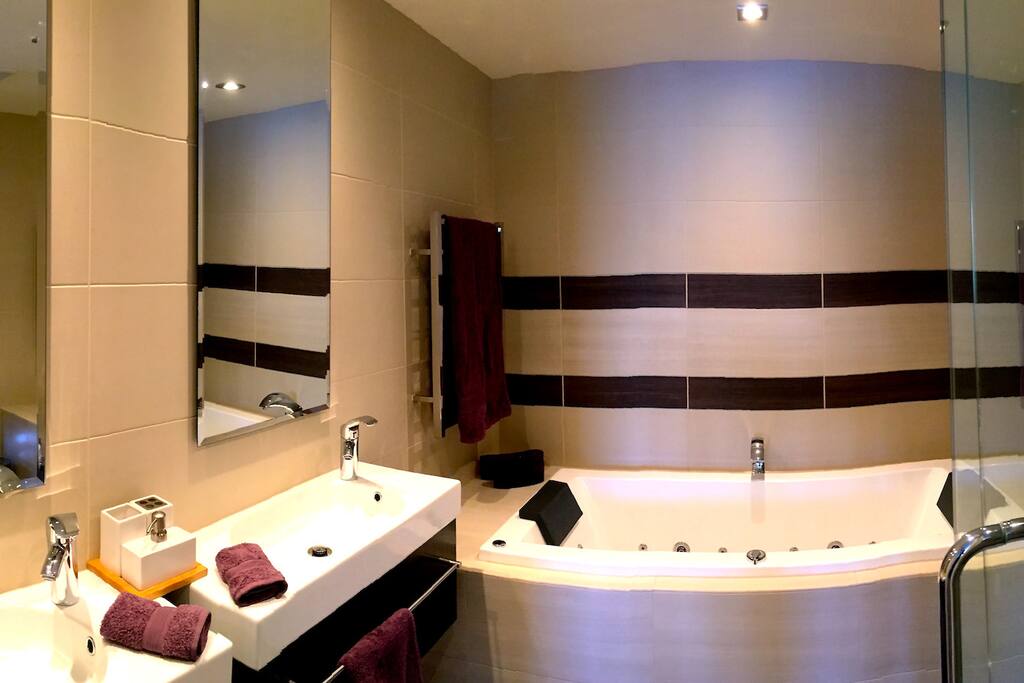 Completely private en suite spa bathroom includes shower and a 2-person jetted bath.