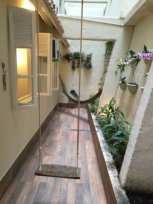 Private outside area, direct sunlight, fresh air, hammocks, swing, hose, water and a beautiful natural garden.