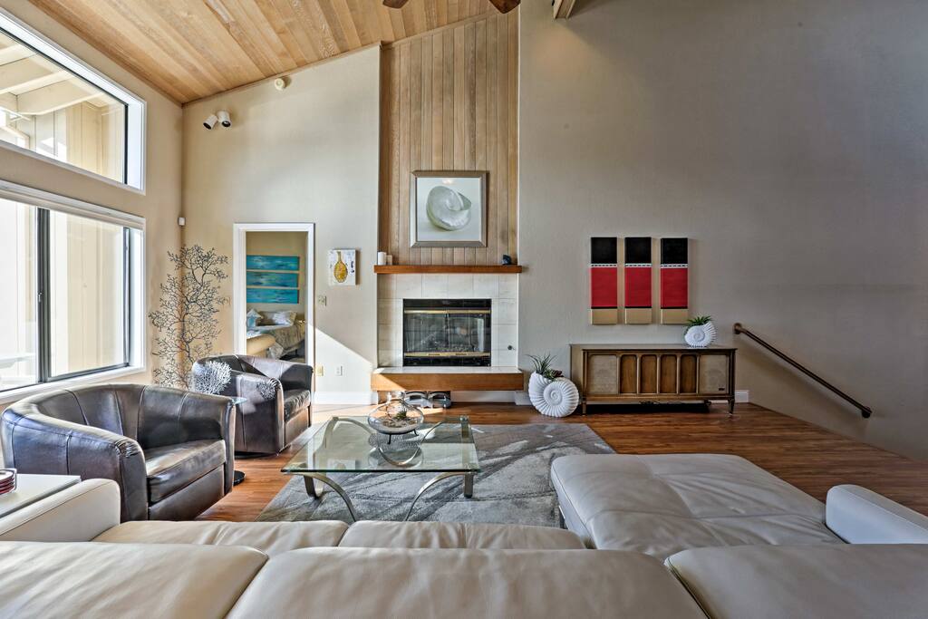 Cozy up by the fireplace in the massive open space living room during your downtime.