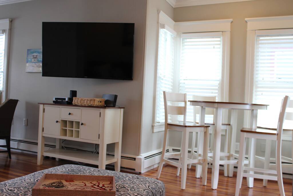 60" LED HD TV with Cable, HBO, and DVD Player. Free Wi-Fi.