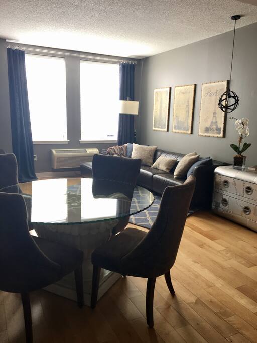 Living are with generously sized leather seating and dining table with seating for 4