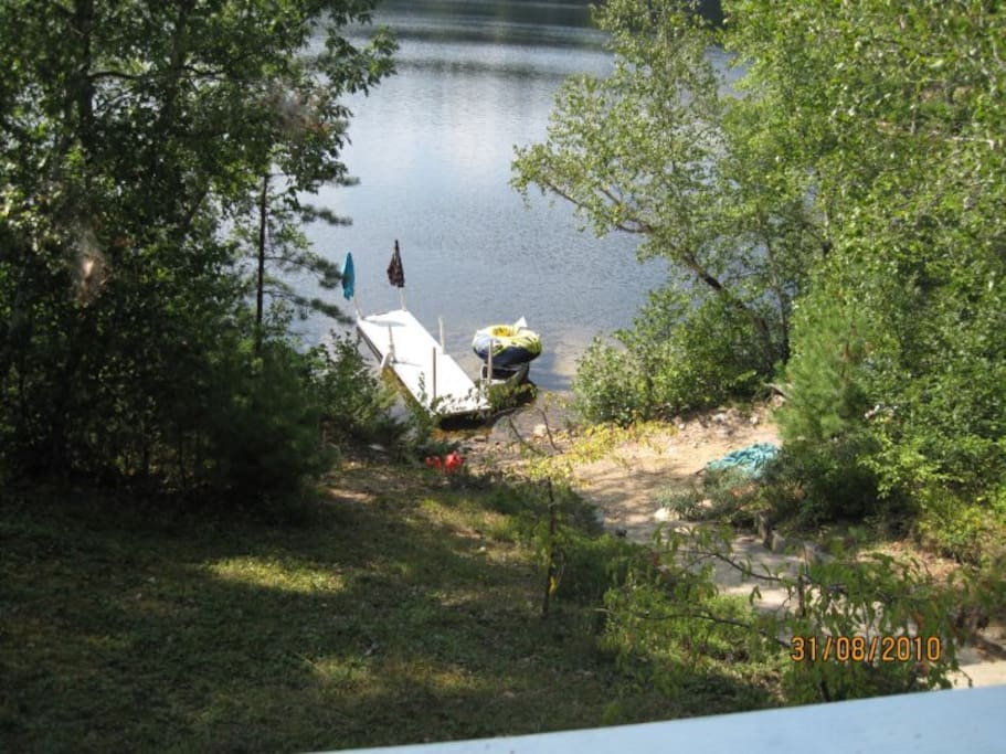 View of beach area and lake from deck