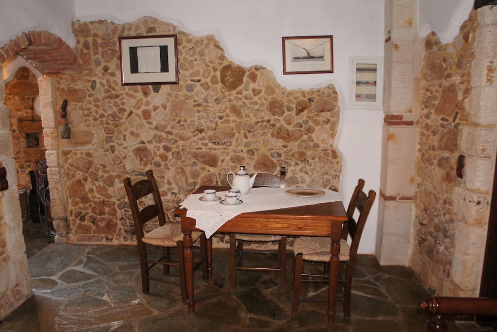 Traditional Dining area, wood table and chairs that can accommodate six people.