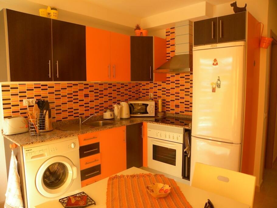 The well equipped open-space kitchen