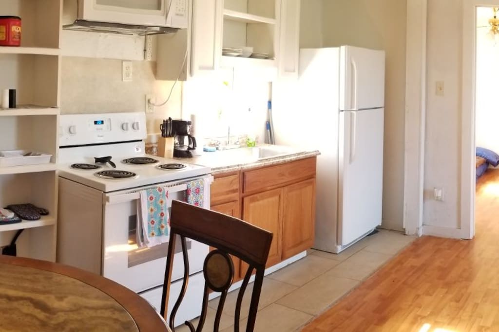 Full Kitchen coffee pot, toaster microwave, pots and pans dishes