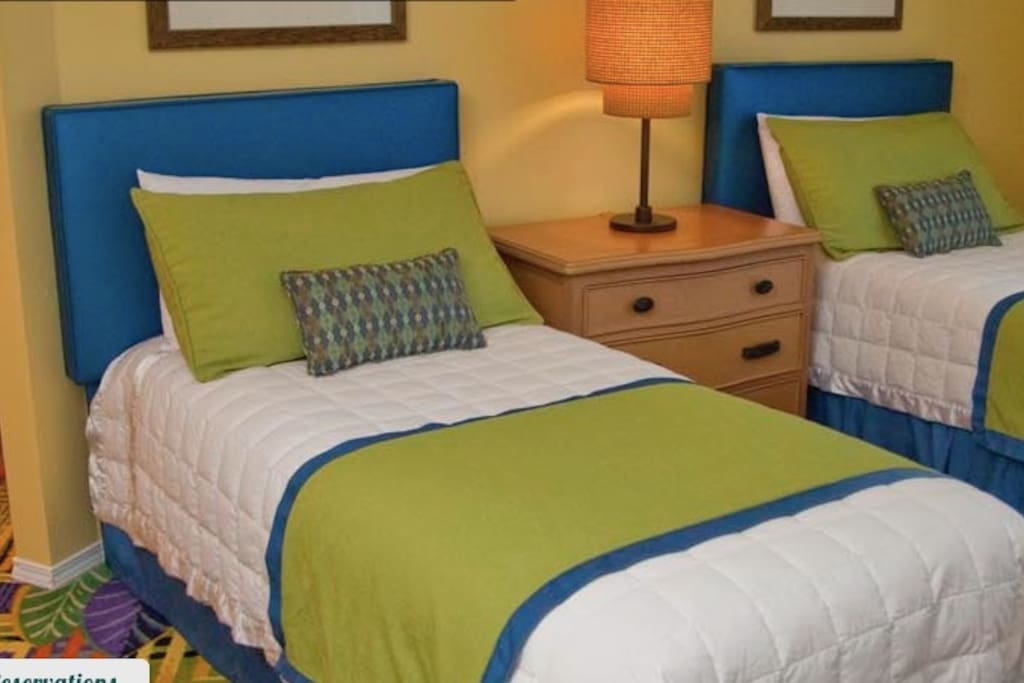 another bedroom has two twin beds with a full bath