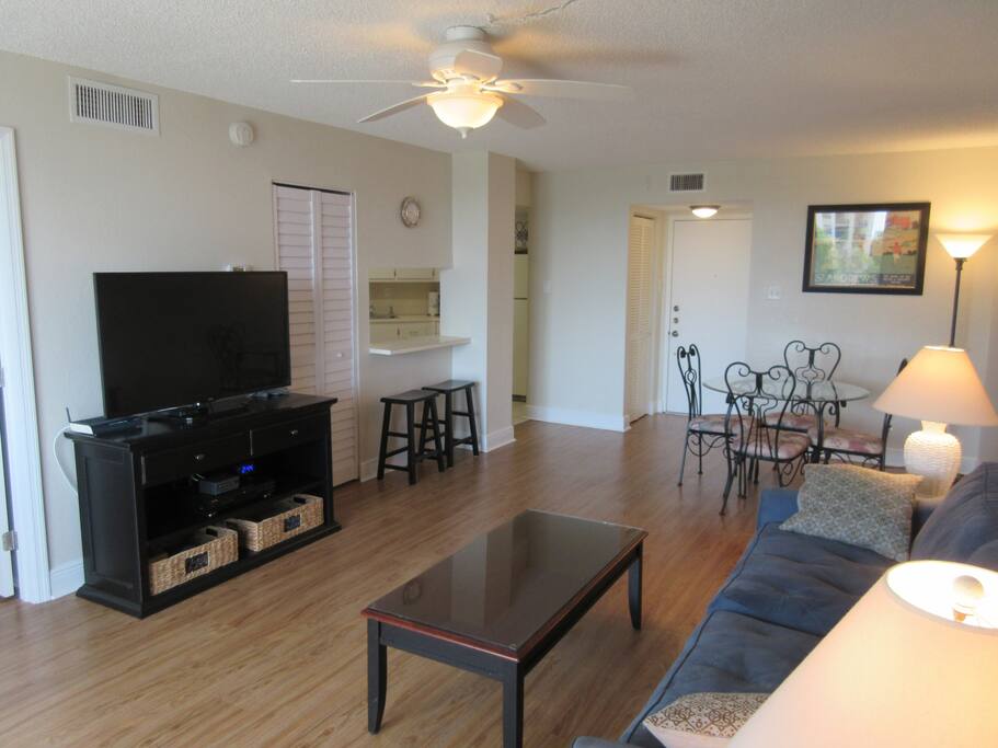 Living Room with 50-inch TV. Dinette area.