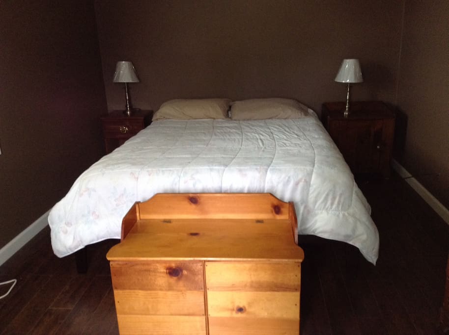New bedroom with queen bed and cable tv