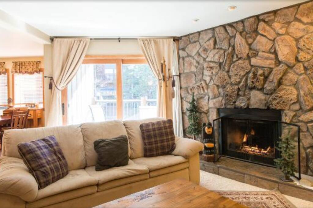 Cozy living room with sofa sleeper and fireplace