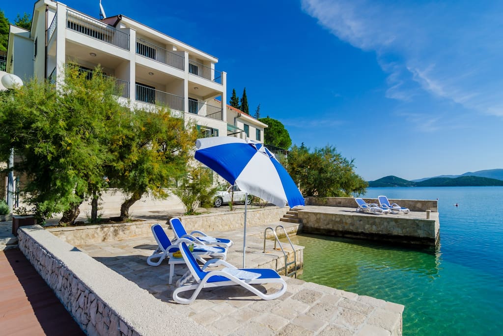 Villa Regina Maris, private deck with shower and sunbeds.