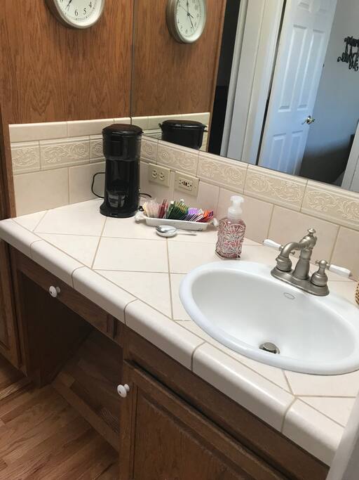 Bathroom with coffee maker.