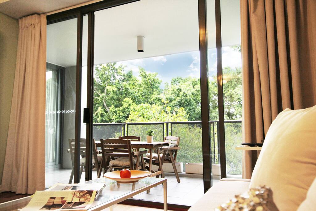 Open plan living room with sliding doors to the balcony.