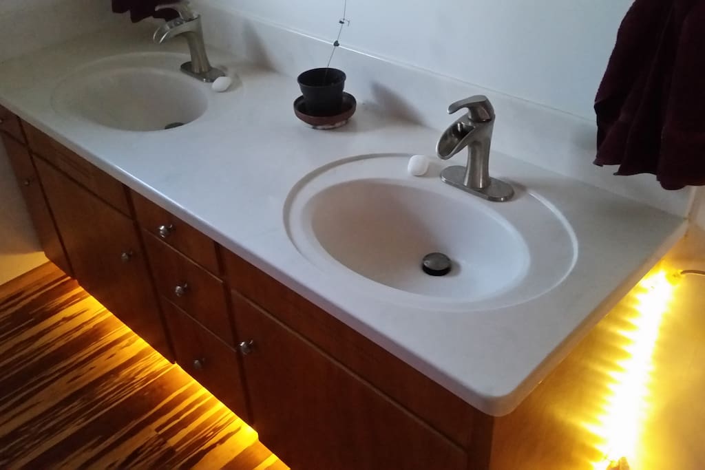 Shared bathroom with under counter safety light.