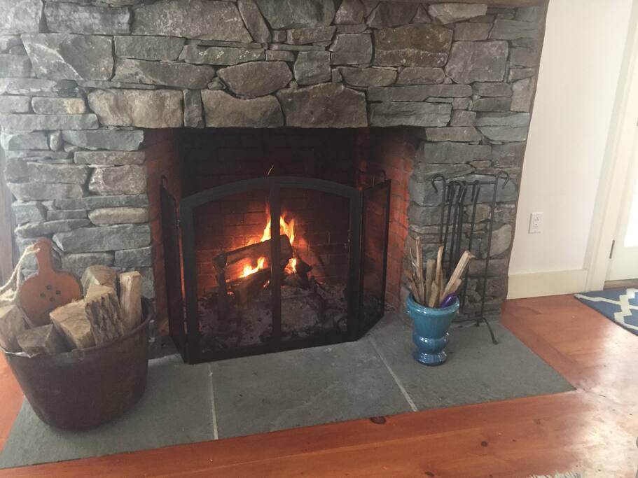 Living room wood-burning fire place. Wood provided.