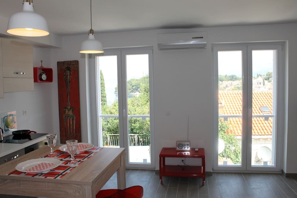 Living/kitchen area with balcony doors