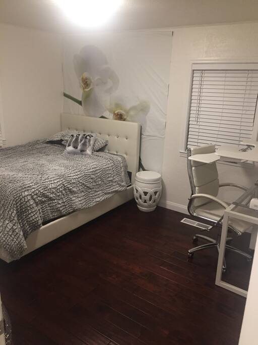 Luxurious white diamond bed with faux fur alligator comforter with bait desk and modern tech gadgets Over $5000 spent on this room to make you feel like your staying at super luxury hotel