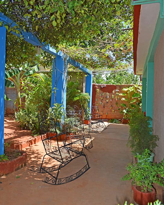 Enjoy our colorful terrace with good cuban coffee or a drink!
