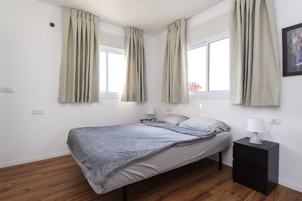 The Bedroom - Twin Bed. New AC and ceiling fan in the room.