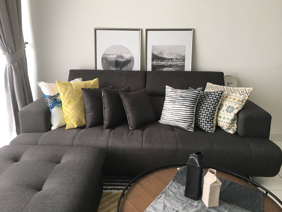 L-shaped couch with adjustable headrest and lotsss of cushion for your ultimate comfort. Large coffee table to accommodate your movie marathon snacks ;)