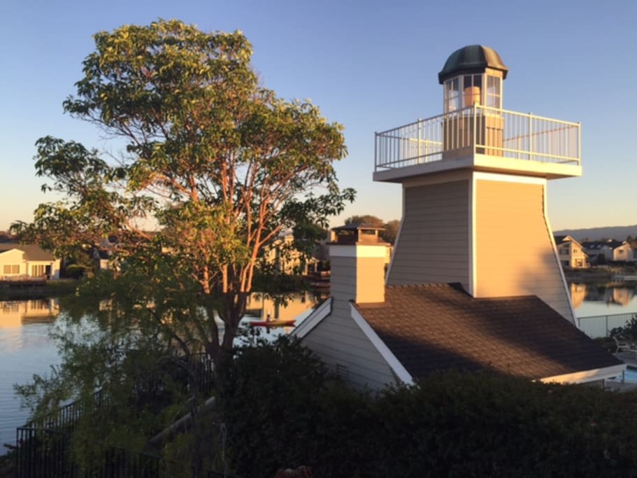Evening light and close-up view of lighthouse from balcony.