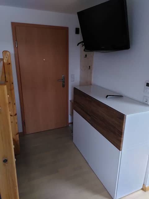 Room with toilet and kitchen